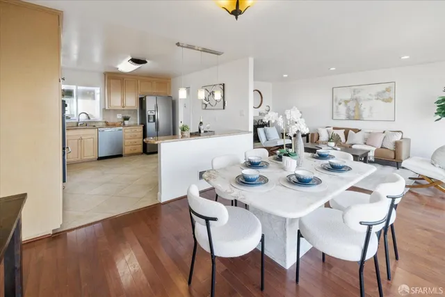 a kitchen with stainless steel appliances a sink a stove a microwave and cabinets