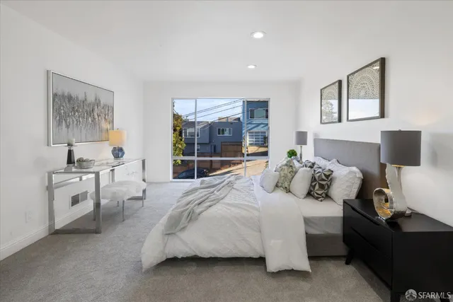 a bed room with a bed and a lamp