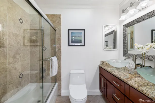 a spacious bedroom with a bed and a window