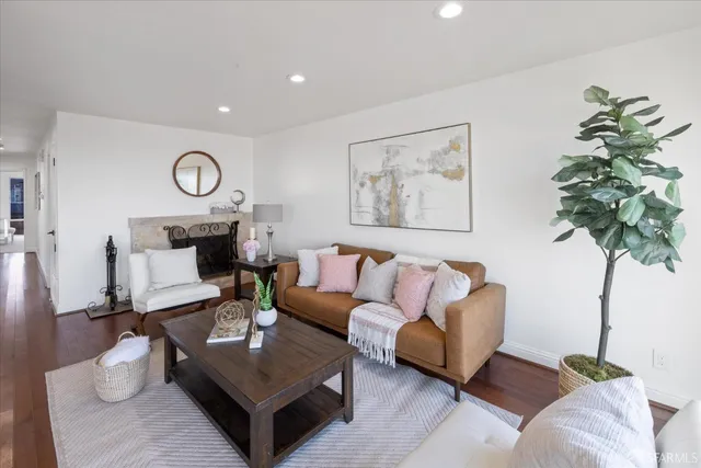 a view of a dining room with furniture and a floor to ceiling window