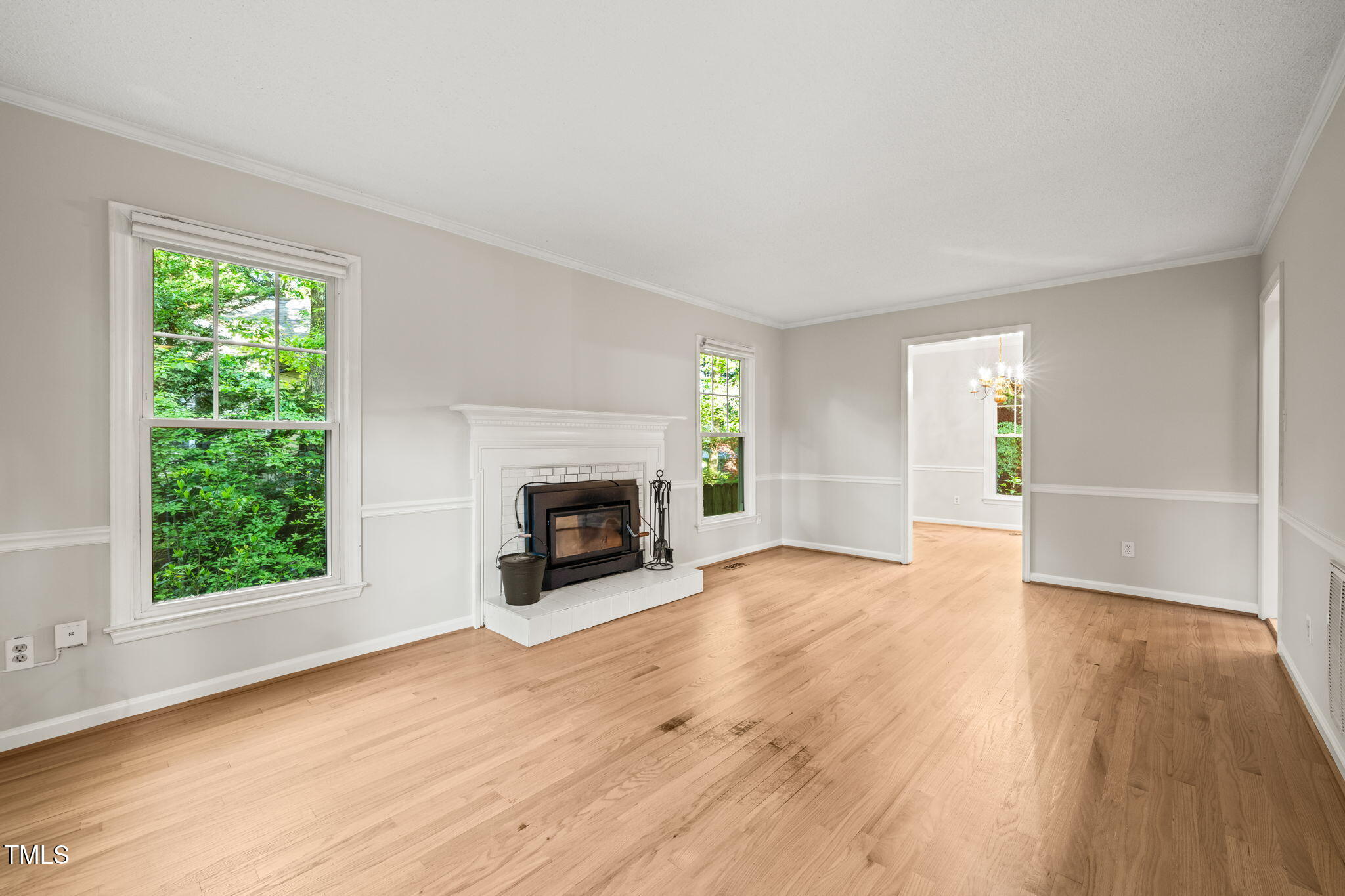 5212 Badham Place Raleigh, NC 27609 - Photo 10 of 40 an empty room with windows and fireplace