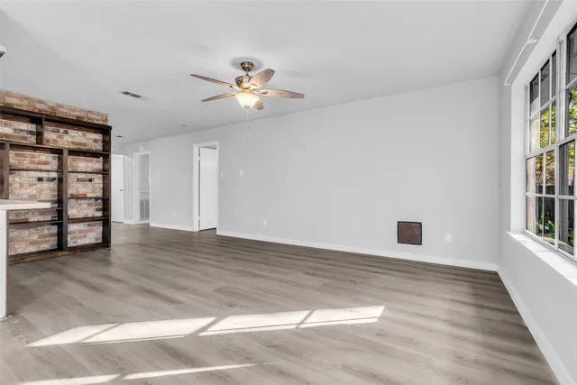 a kitchen with a refrigerator and a stove top oven