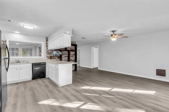 a kitchen with a sink stove and microwave
