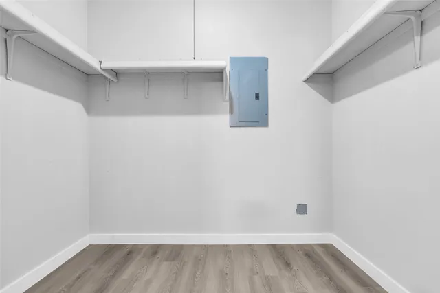 a view of hallway with wooden floor