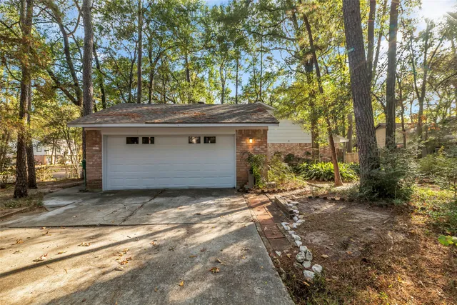 a view of a house with a tree in the background