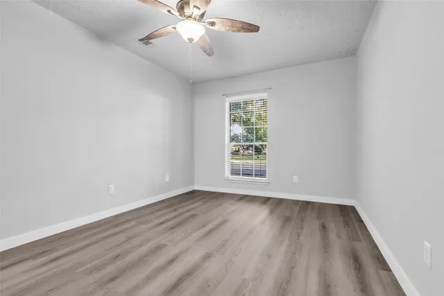 a bathroom with a sink and a mirror with bathtub