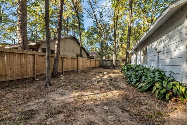 a backyard of a house with lots of green space