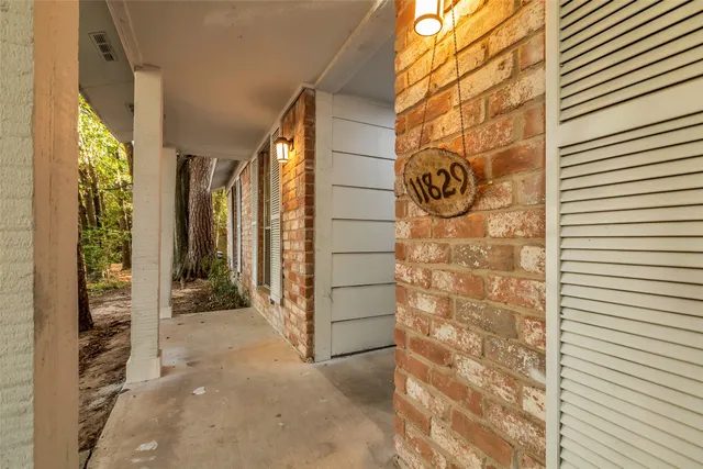 a view of door with wooden wall