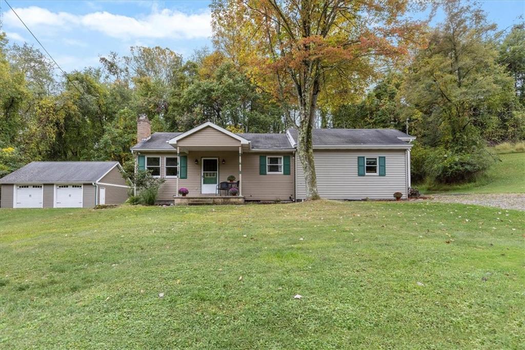 207 Amsler Road Sewickley, PA 15143 - Photo 1 of 33 a front view of a house with a garden