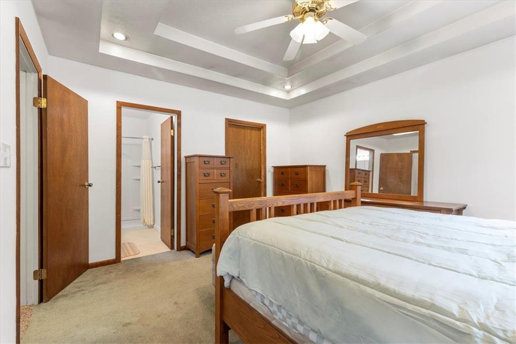 207 Amsler Road Sewickley, PA 15143 - Photo 14 of 33 a bedroom with a large bed a flat tv screen and dresser