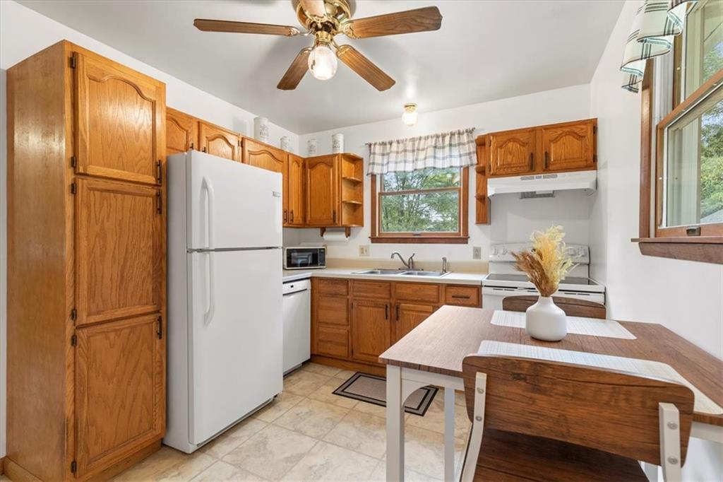 207 Amsler Road Sewickley, PA 15143 - Photo 8 of 33 a kitchen with a refrigerator a sink and cabinets