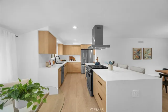 a view of living room with furniture and a potted plant