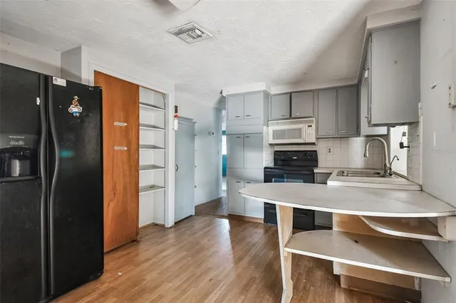 a view of a double sink and a mirror