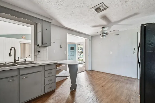 a kitchen with a sink and a window