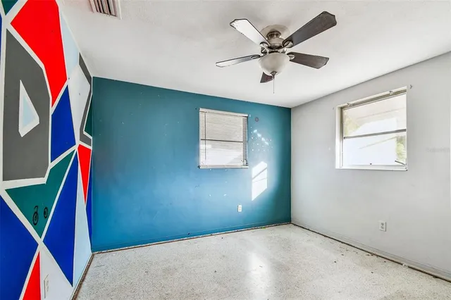 a white toilet sitting next to a shower