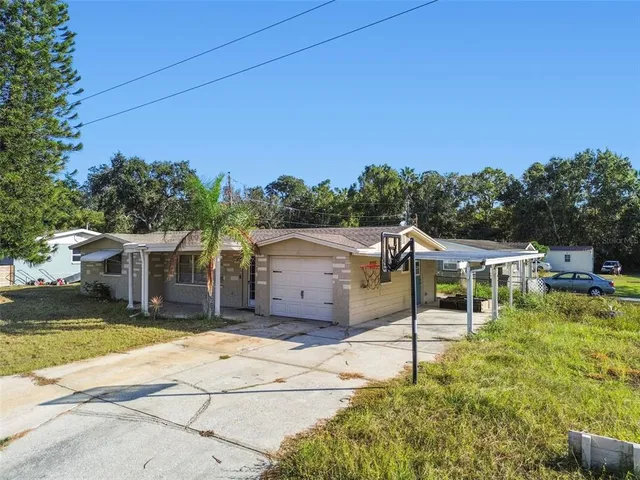 aerial view of a house with a yard