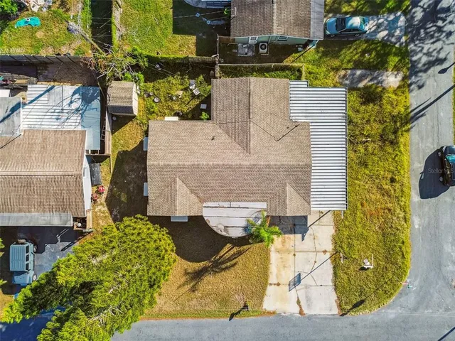 an aerial view of residential houses with outdoor space