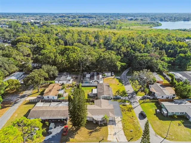 an aerial view of residential houses with outdoor space