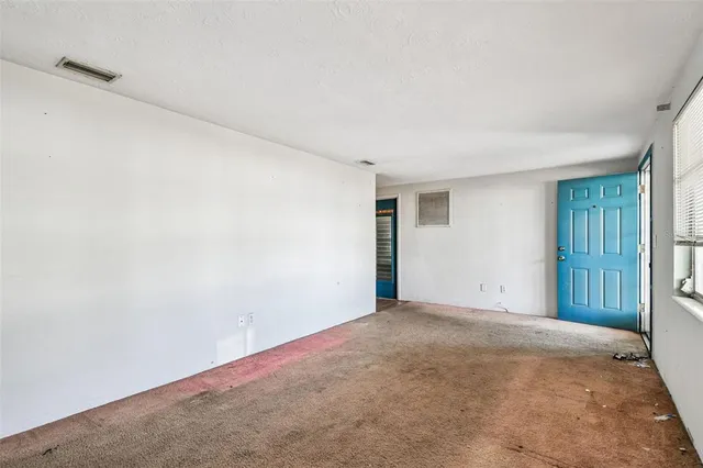 a view of an empty room and window