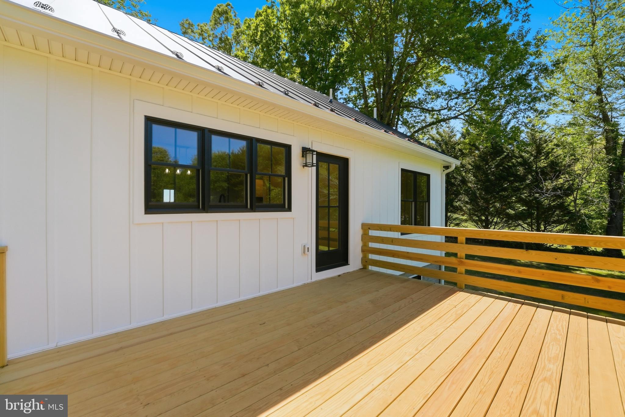 1548 James City Road Reva, VA 22735 - Photo 35 of 48 a view of a roof deck with wooden floor and fence