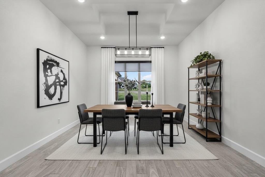 1039 Monaco Court Springtown, TX 76082 - Photo 10 of 33 Dining area featuring a linear chandelier- Virtually staged