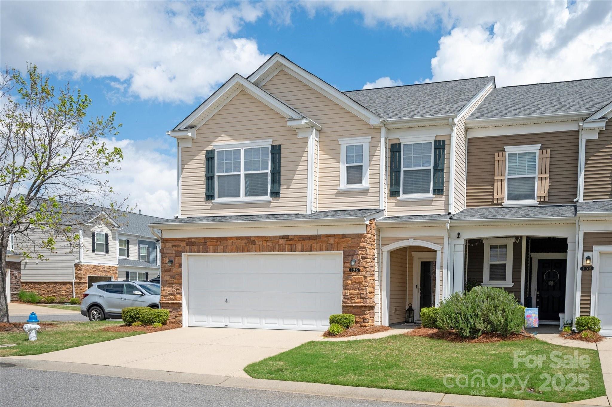 158 Council House Road Fort Mill, SC 29708 - Photo 1 of 41 a front view of a house with a yard and garage