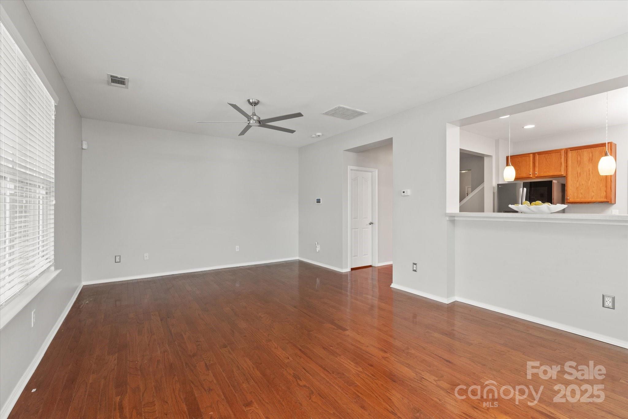 158 Council House Road Fort Mill, SC 29708 - Photo 12 of 41 wooden floor in an empty room with a window