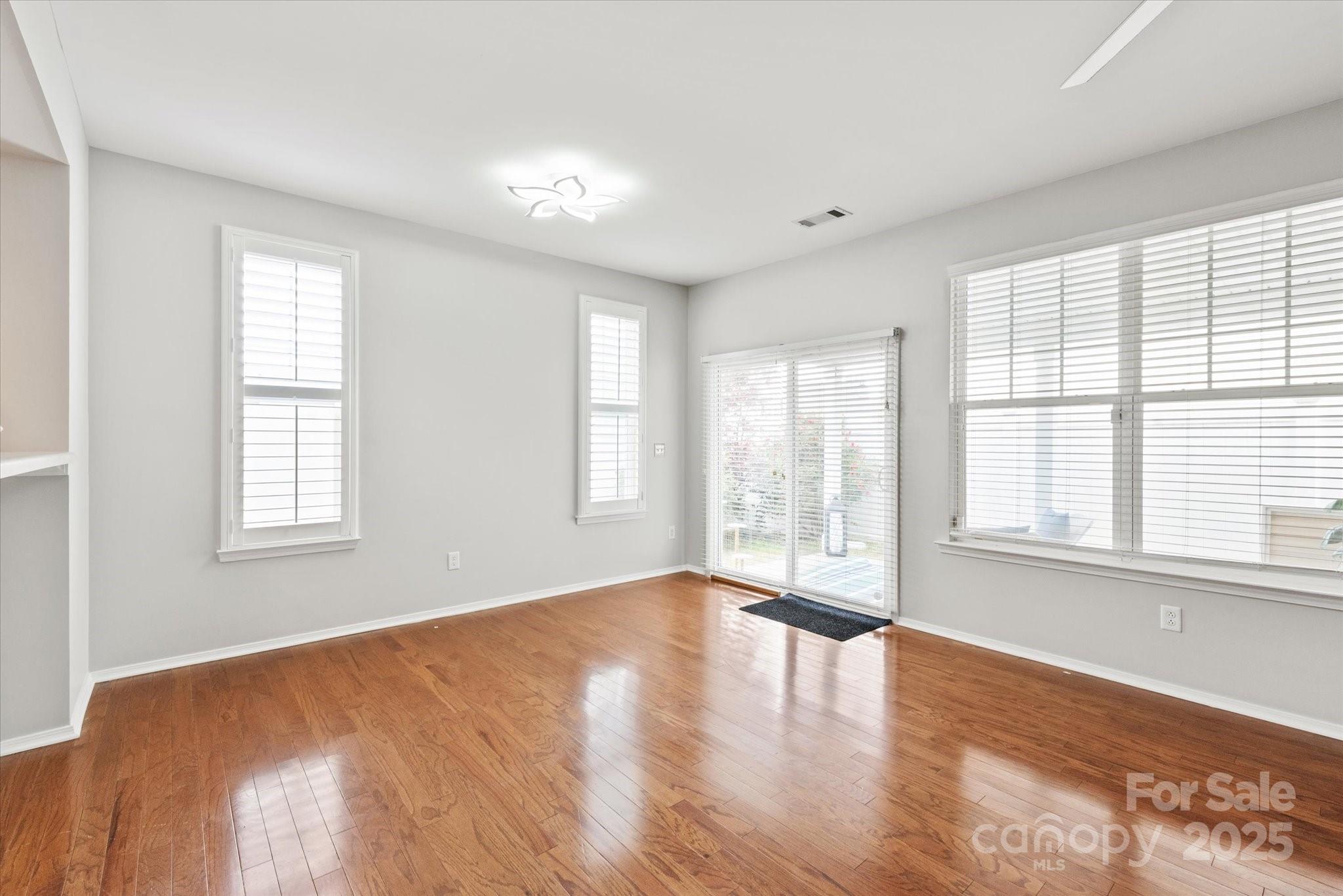 158 Council House Road Fort Mill, SC 29708 - Photo 13 of 41 a view of an empty room with wooden floor and a window