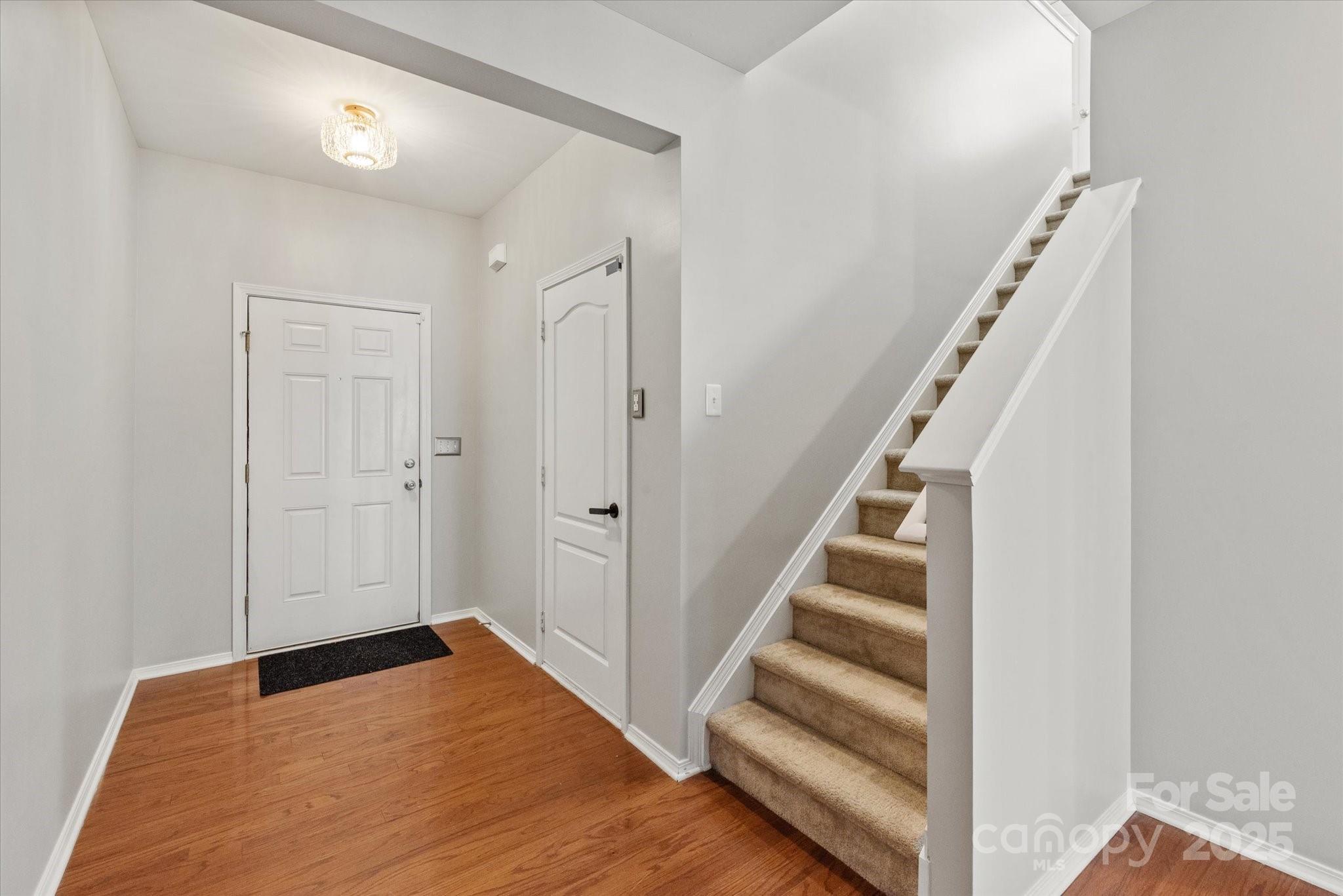 158 Council House Road Fort Mill, SC 29708 - Photo 15 of 41 a view of entryway with stairs and wooden floor