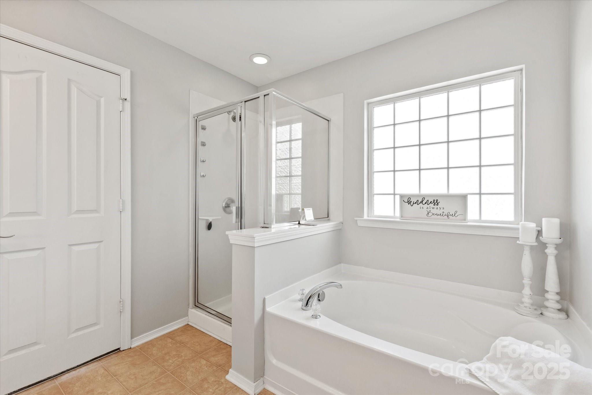 158 Council House Road Fort Mill, SC 29708 - Photo 19 of 41 a bathroom with a bathtub and a shower