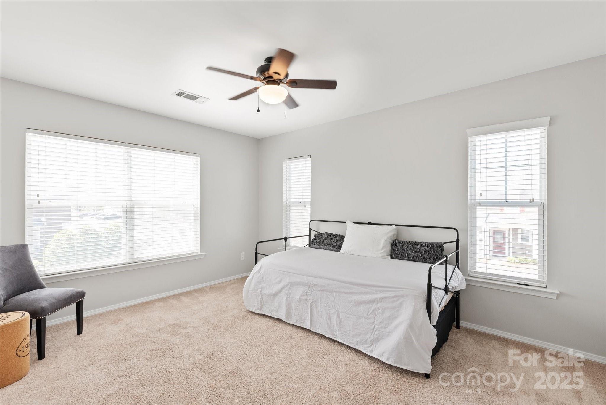 158 Council House Road Fort Mill, SC 29708 - Photo 23 of 41 a bedroom with a large bed and two window