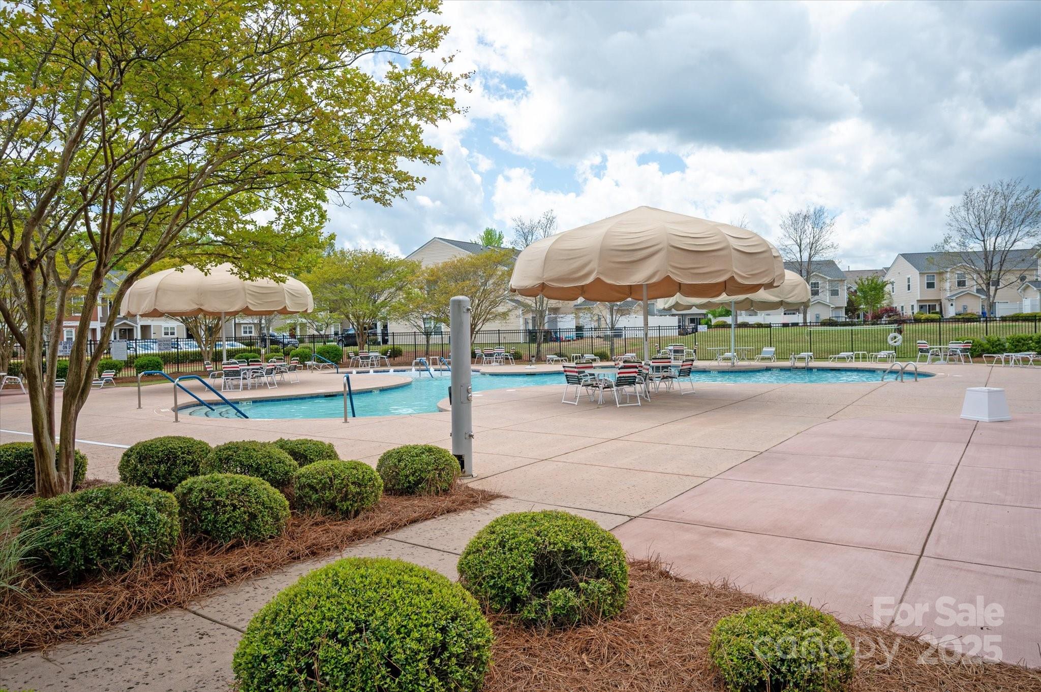 158 Council House Road Fort Mill, SC 29708 - Photo 40 of 41 a view of swimming pool with outdoor seating and a garden
