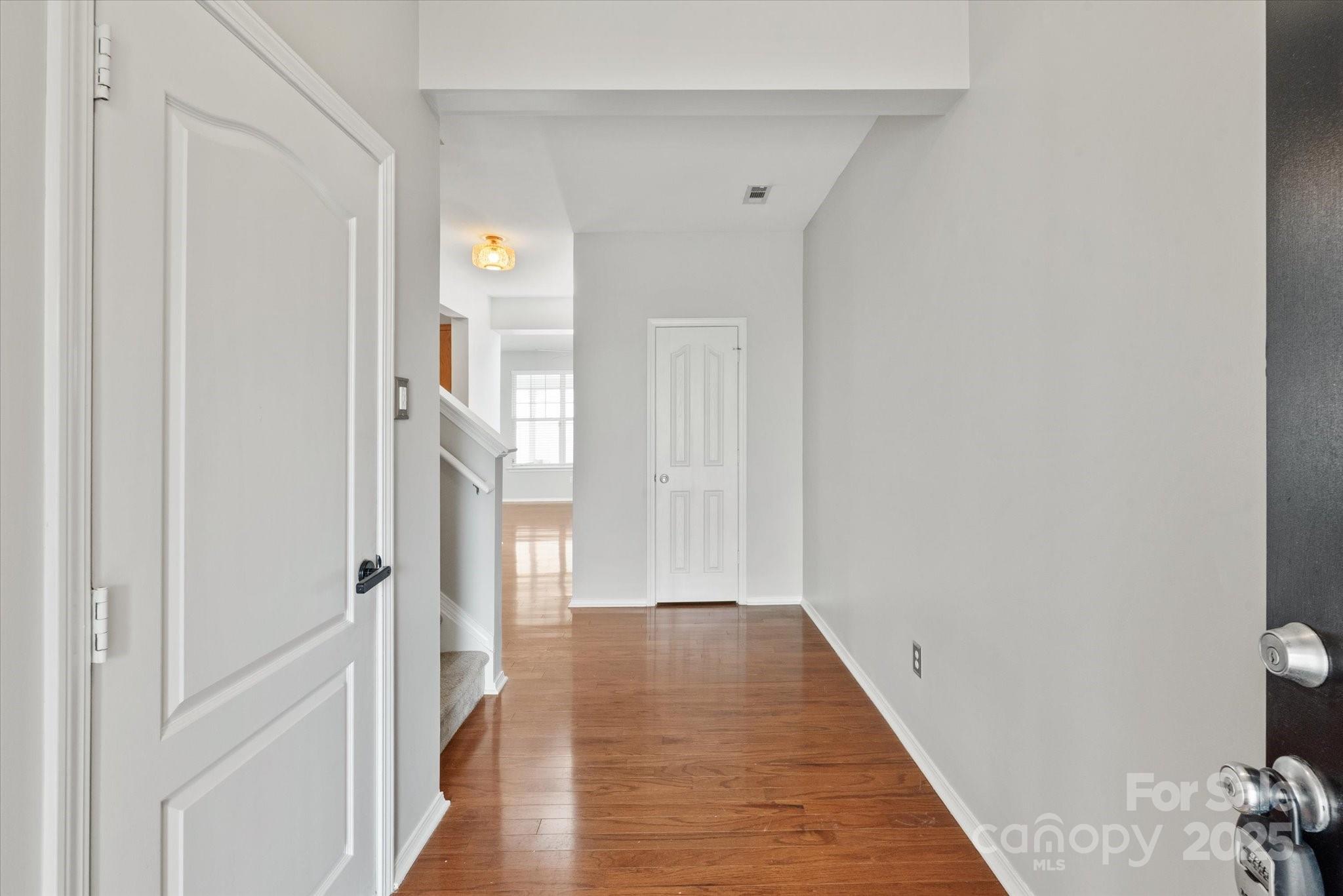 158 Council House Road Fort Mill, SC 29708 - Photo 4 of 41 a view of a hallway with wooden floor and a bathroom