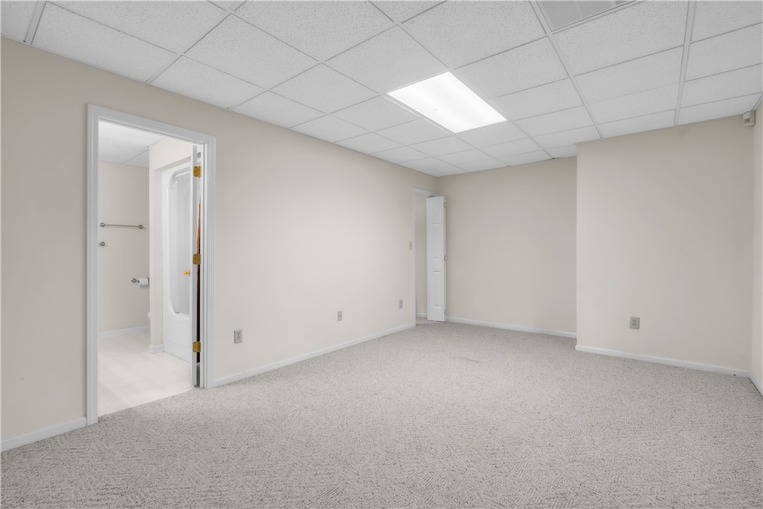 149 Inlet Pointe Drive Anderson, SC 29625 - Photo 12 of 43 A versatile open-plan room featuring soft carpeted floors, ready for personalized design.