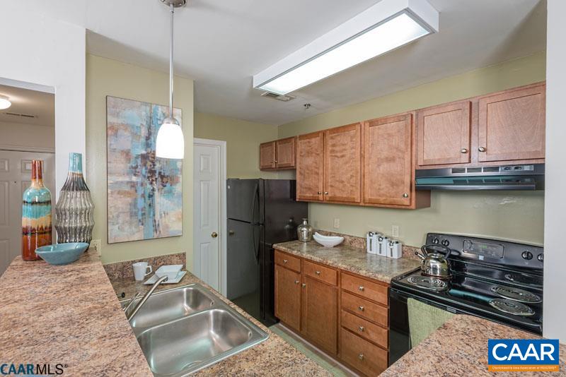 200 Lake Club Court Charlottesville, VA 22902 - Photo 1 of 17 a kitchen with granite countertop a stove a sink and a refrigerator