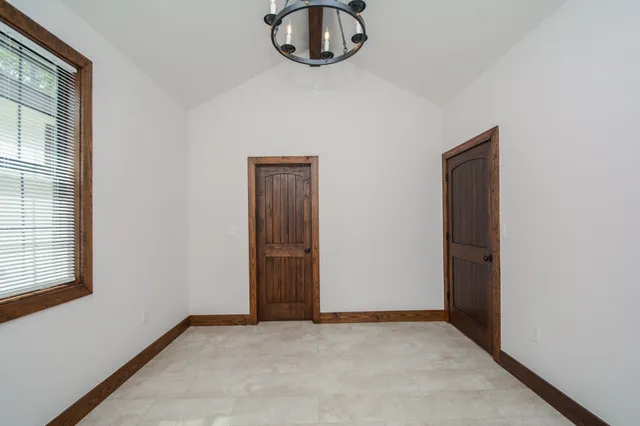 a bathroom with a granite countertop sink a toilet and a mirror