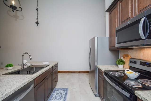 a kitchen with a stove and a microwave