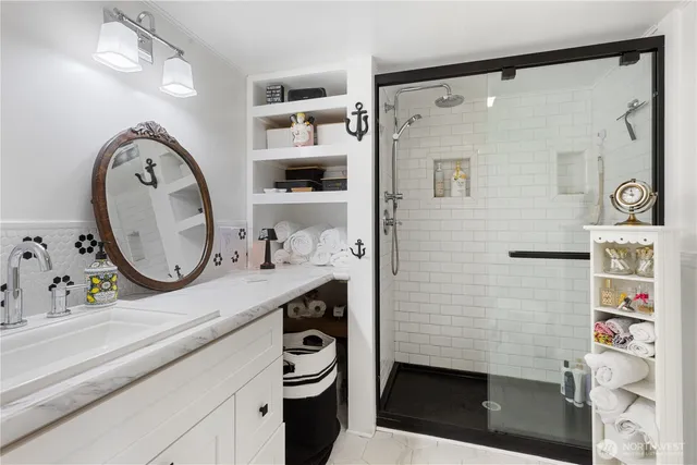 a bathroom with a sink a vanity and a mirror
