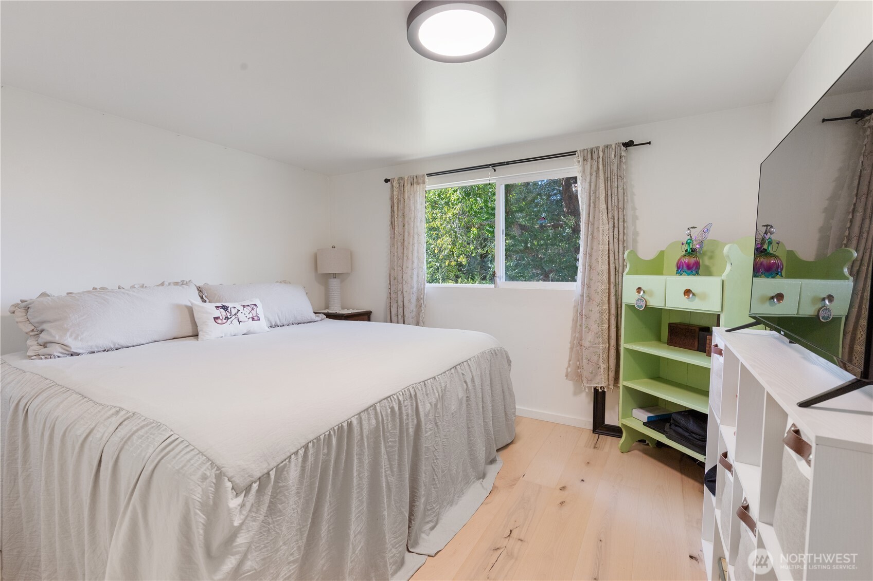 21 2nd Street Bay Center, WA 98586 - Photo 14 of 21 a bedroom with a bed and a window