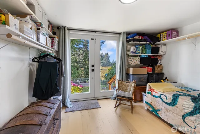a bedroom with furniture and a book shelf