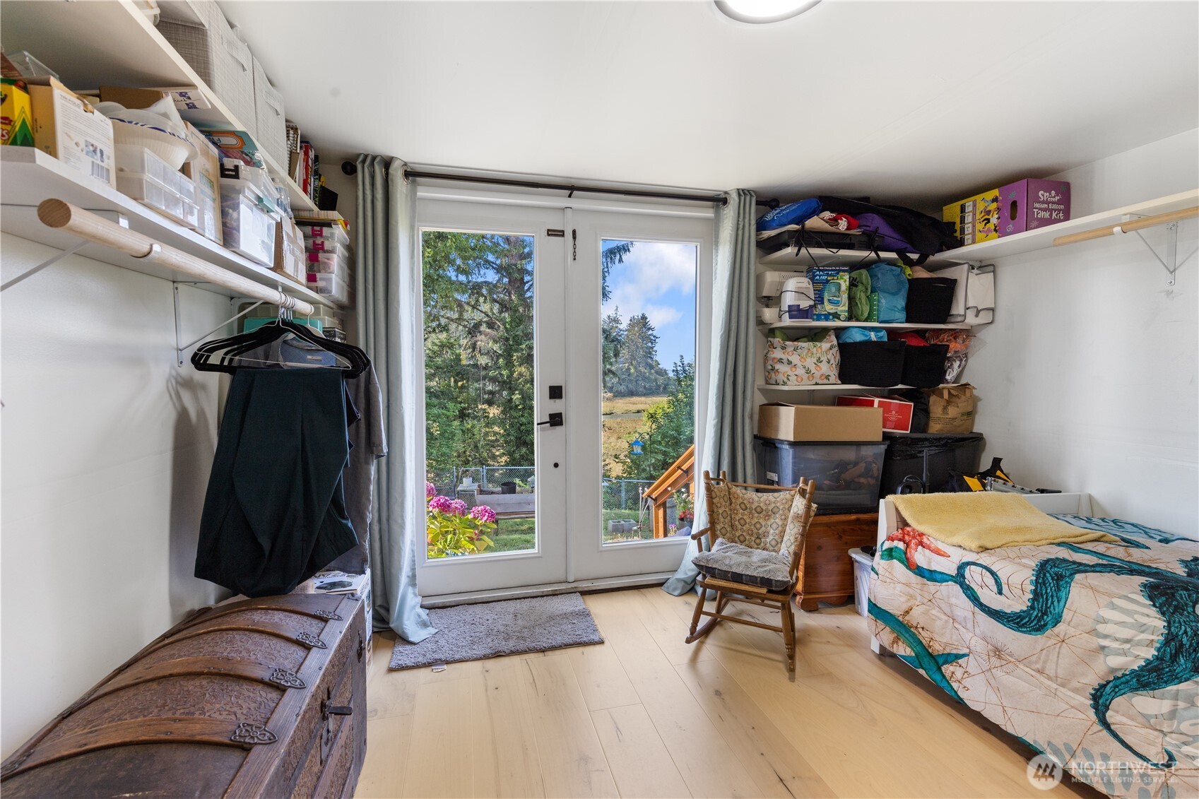 21 2nd Street Bay Center, WA 98586 - Photo 15 of 21 a bedroom with furniture and a book shelf