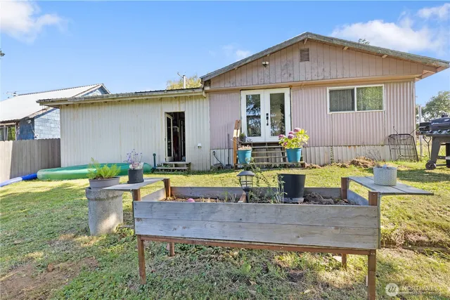 a view of house with swimming pool outdoor seating