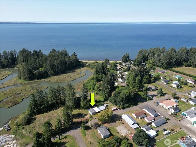 an aerial view of a city and mountain view in back