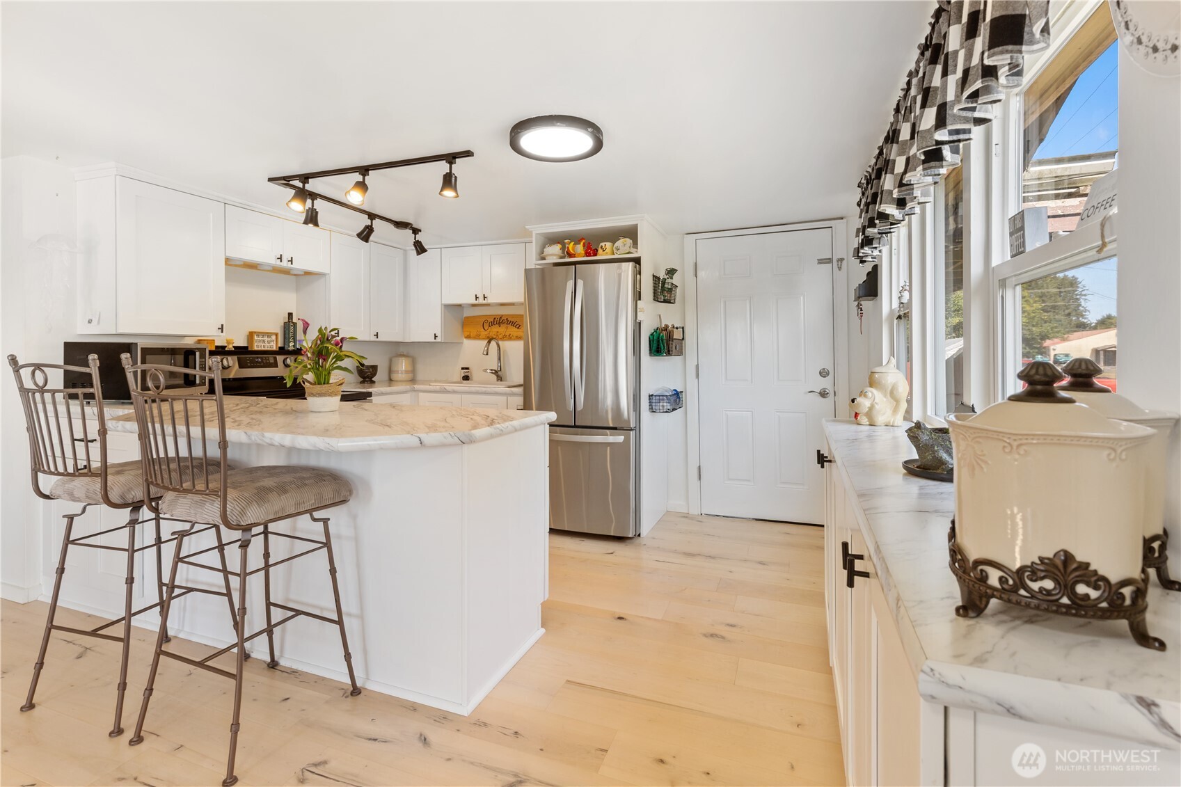 21 2nd Street Bay Center, WA 98586 - Photo 5 of 21 a kitchen with a sink cabinets and appliances