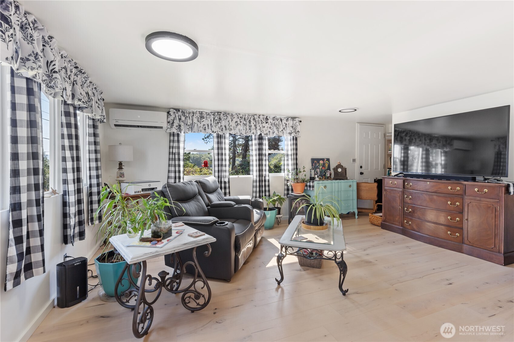 21 2nd Street Bay Center, WA 98586 - Photo 8 of 21 a living room with furniture and a flat screen tv