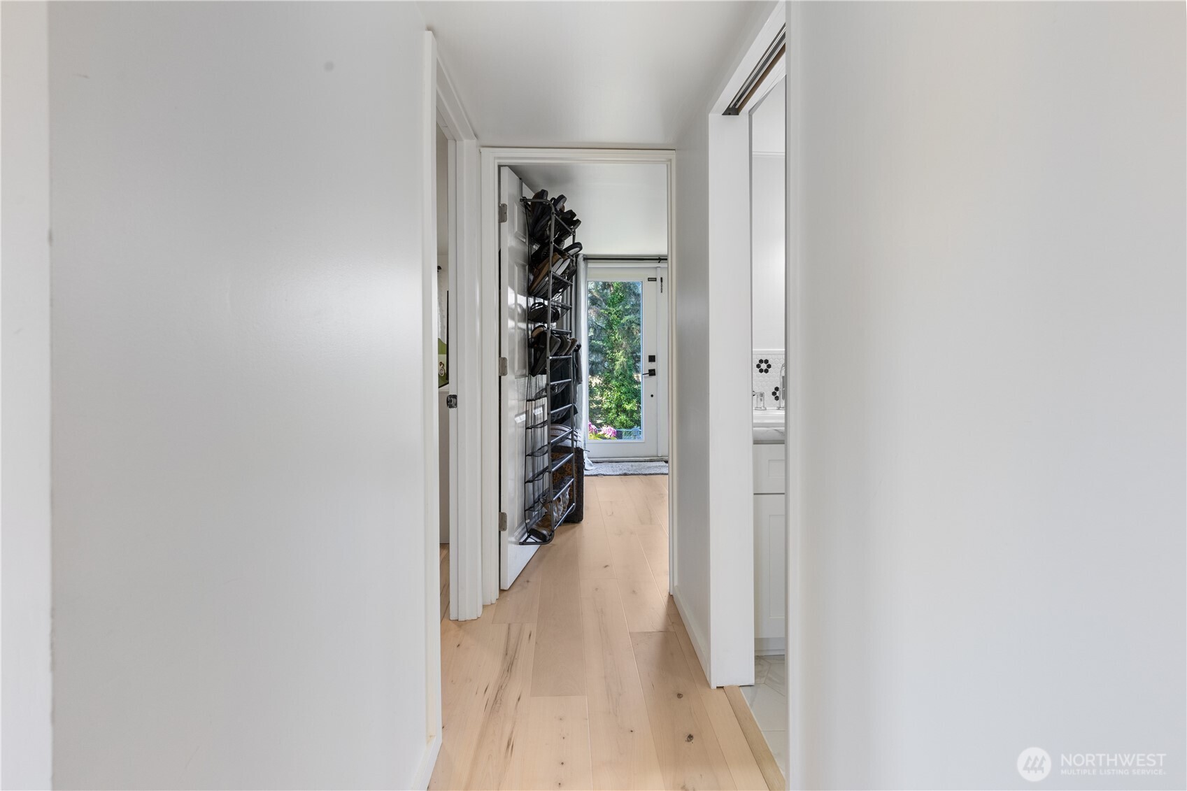 21 2nd Street Bay Center, WA 98586 - Photo 10 of 21 a view of a hallway with wooden floor and a bathroom