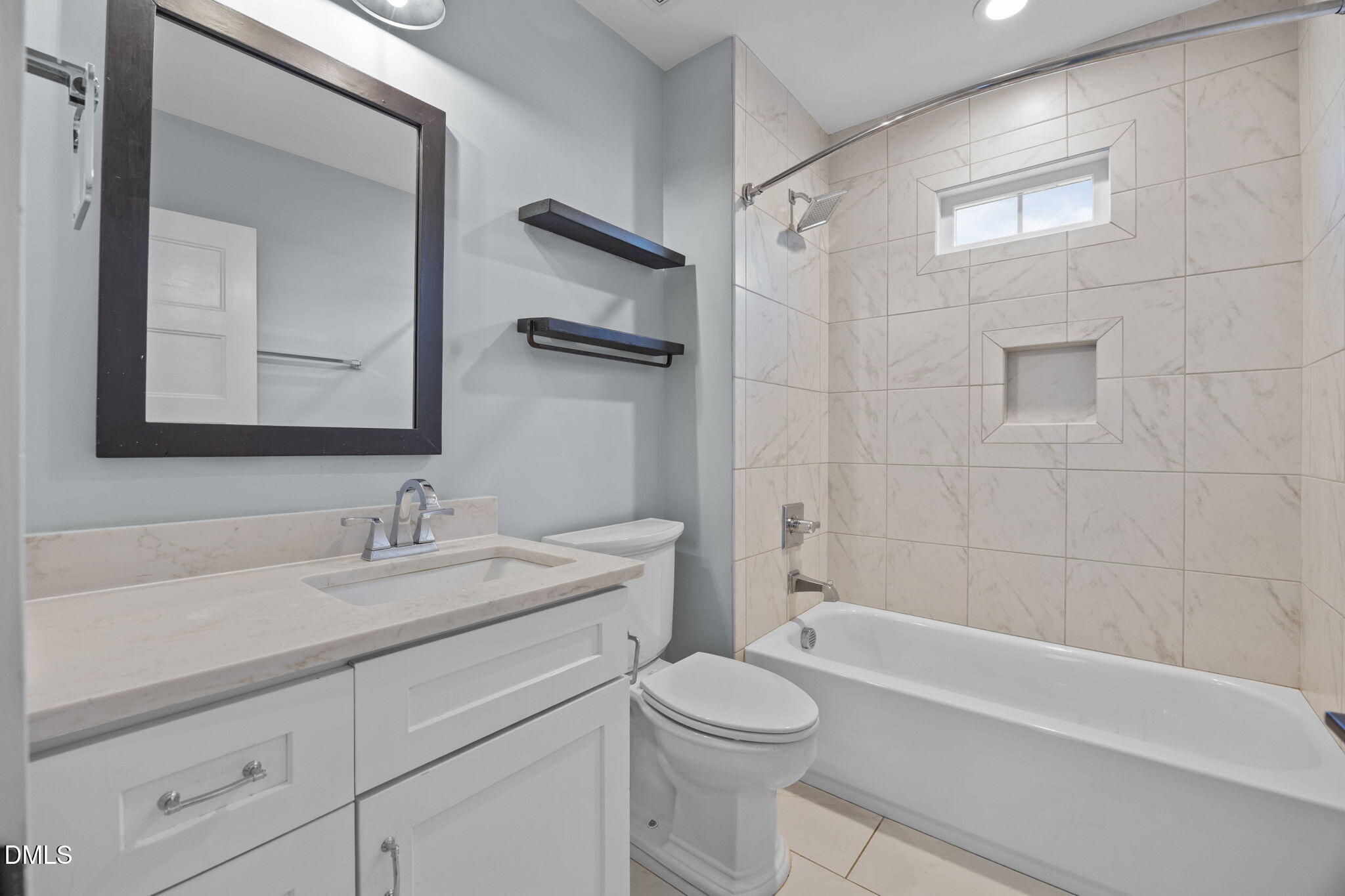 603 Frank Street Raleigh, NC 27604 - Photo 16 of 29 a bathroom with a sink a toilet and shower