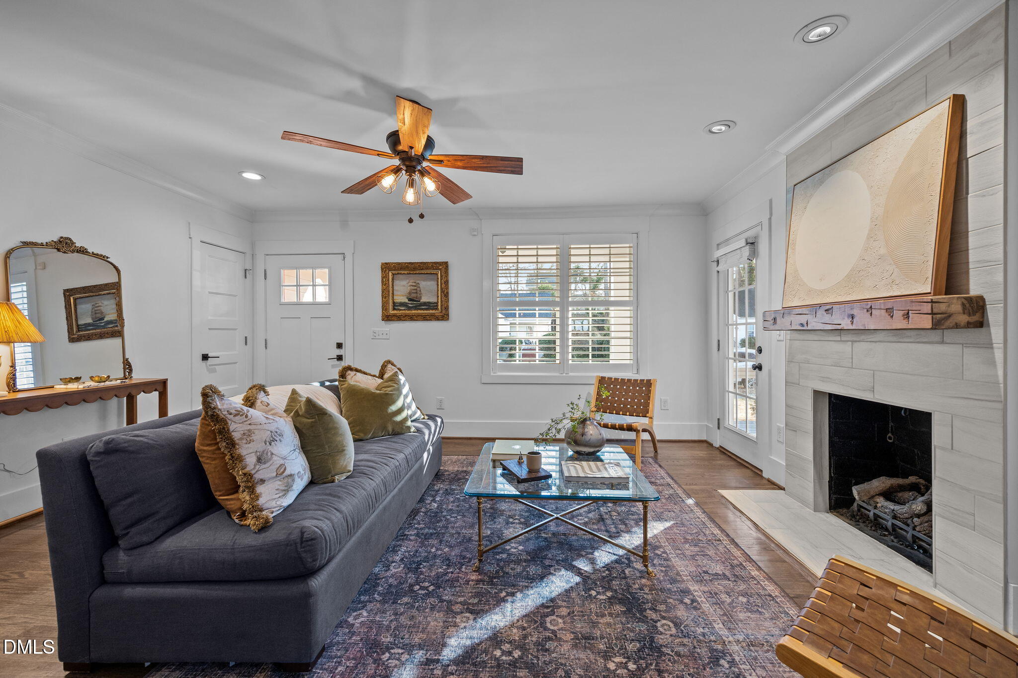 603 Frank Street Raleigh, NC 27604 - Photo 3 of 29 a living room with furniture a fireplace with wooden floor