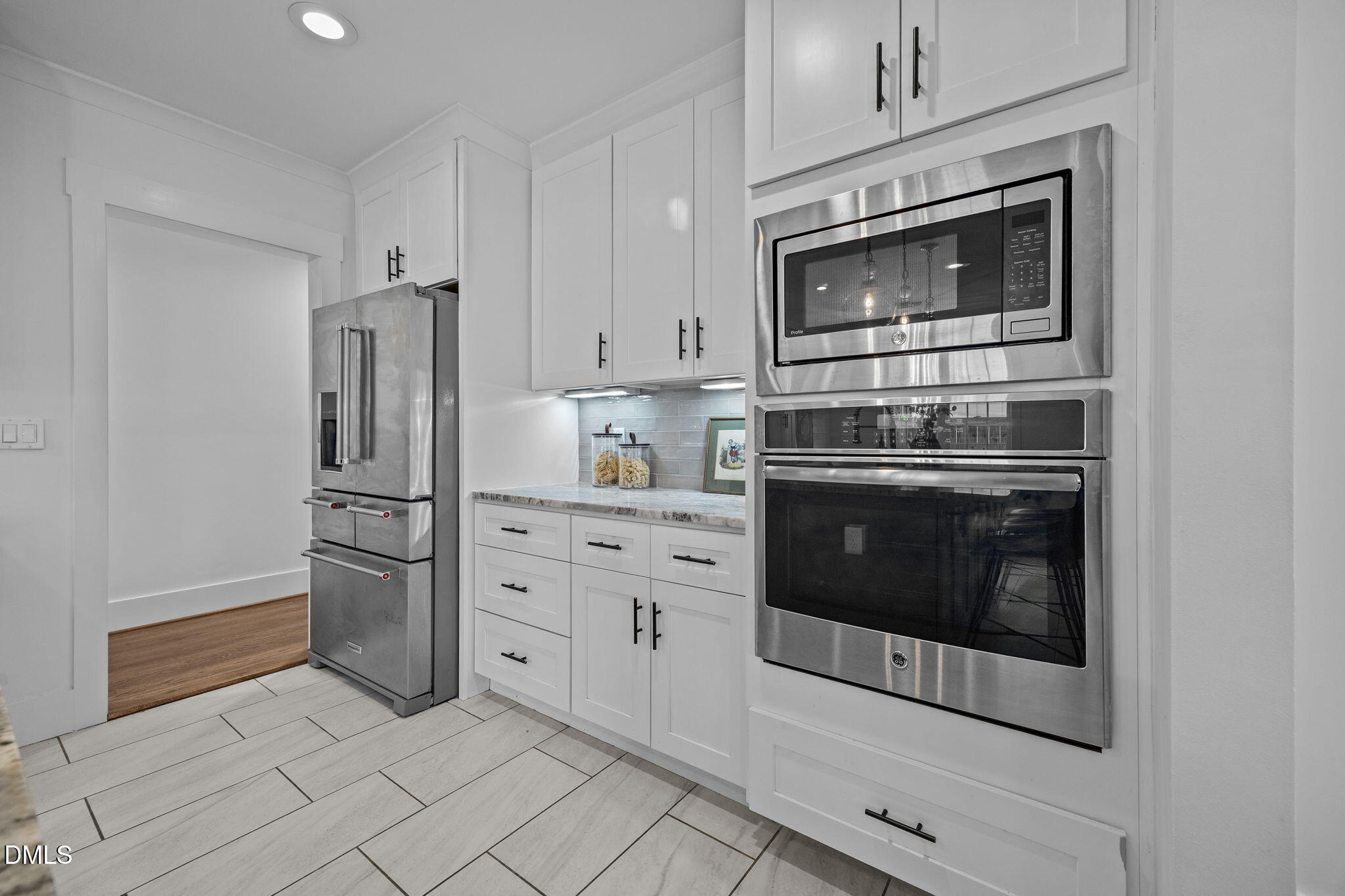 603 Frank Street Raleigh, NC 27604 - Photo 7 of 29 a kitchen with cabinets stainless steel appliances and a counter space