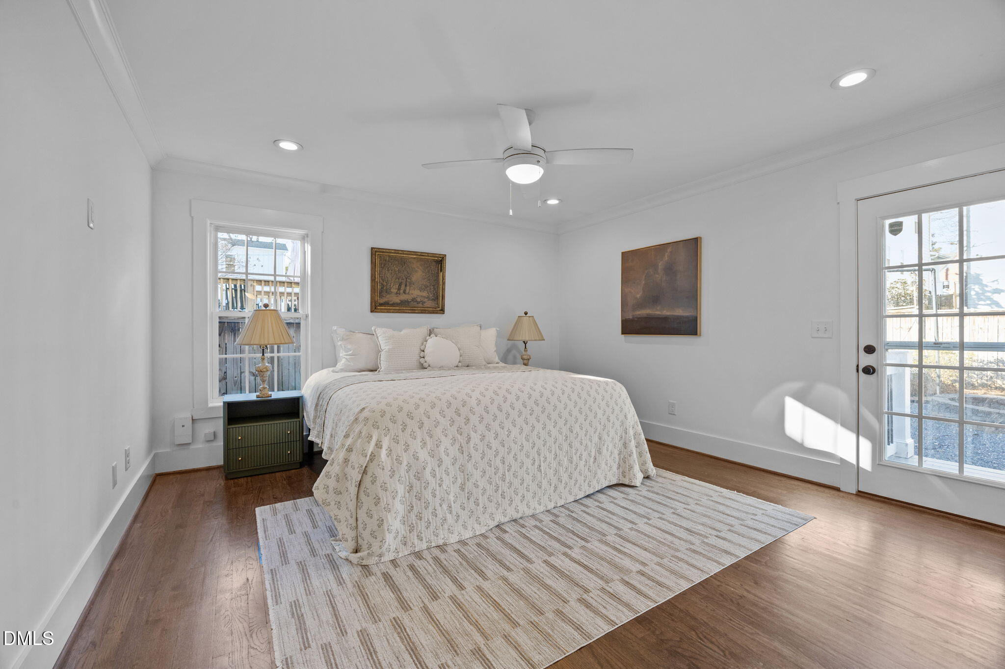 603 Frank Street Raleigh, NC 27604 - Photo 9 of 29 a bedroom with a large bed chandelier and a window